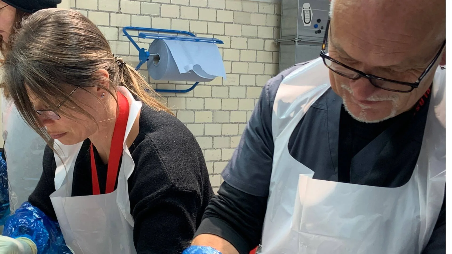 Carolyn Hitchcock learning advanced dissection techniques from an instructor.